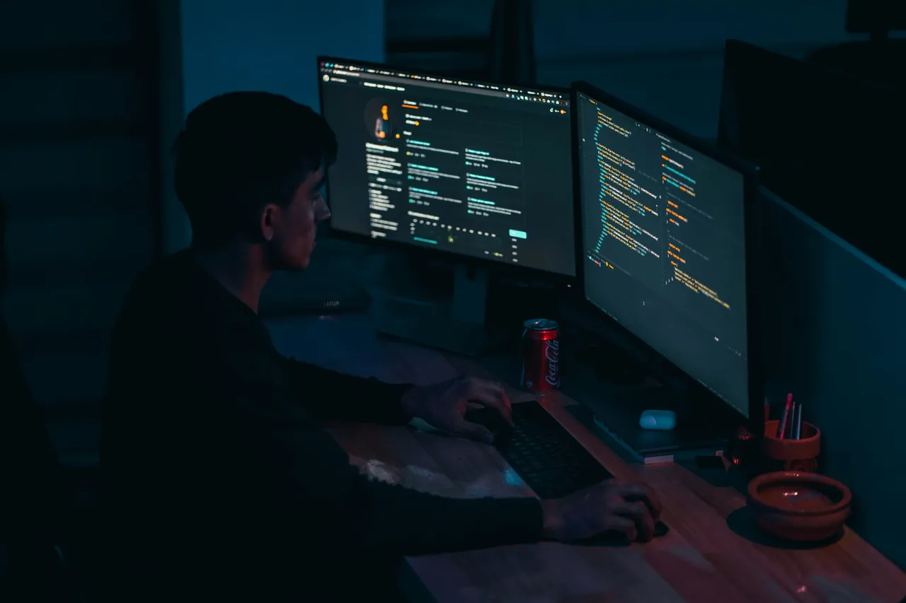 Developer working on code at a laptop