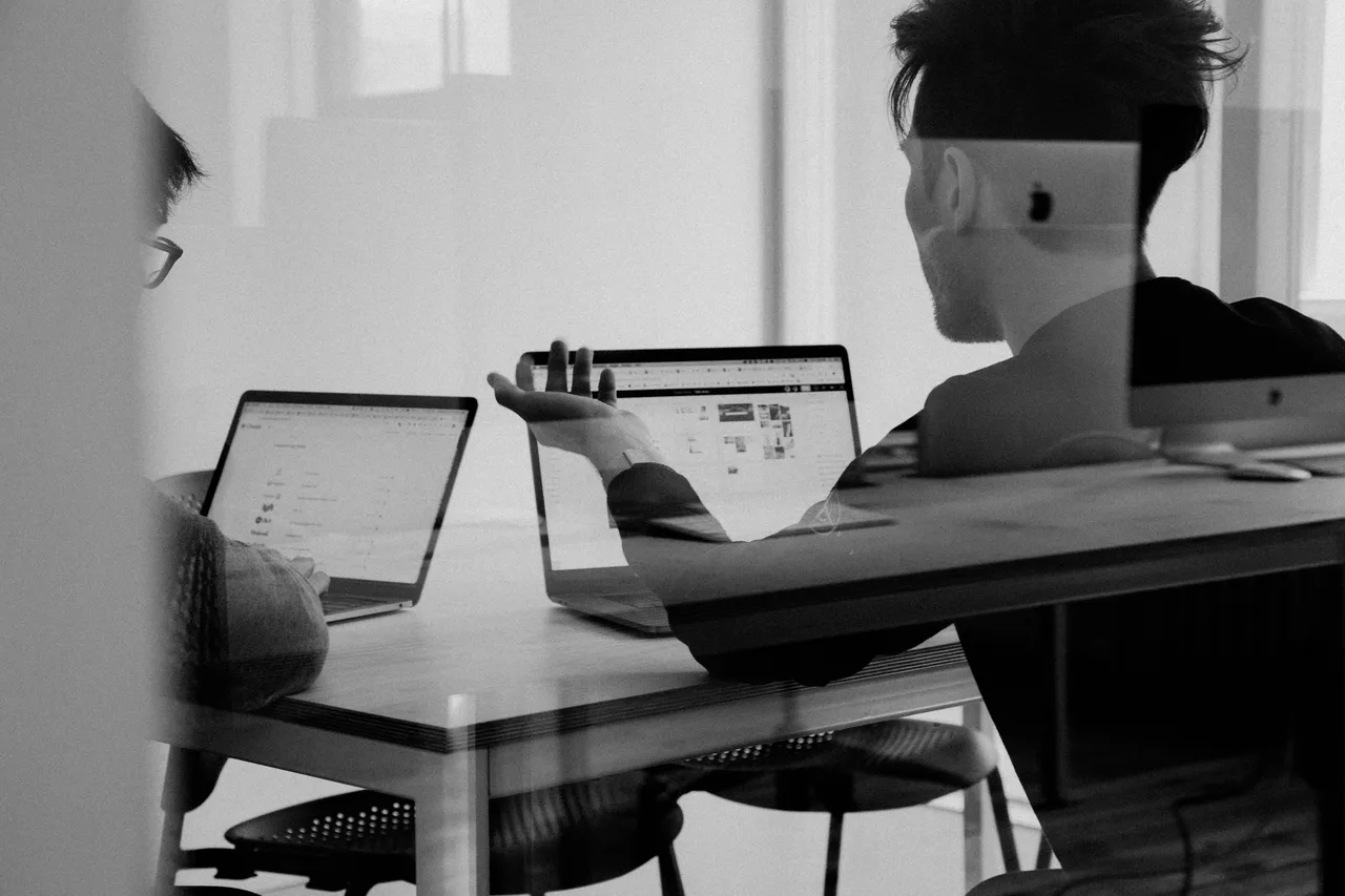 Person reviewing a website on a laptop