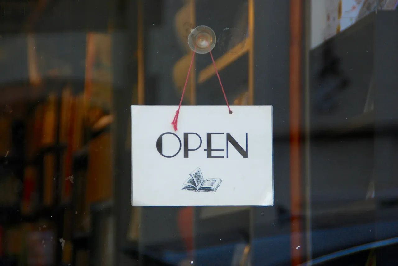 Open sign displayed in a storefront window